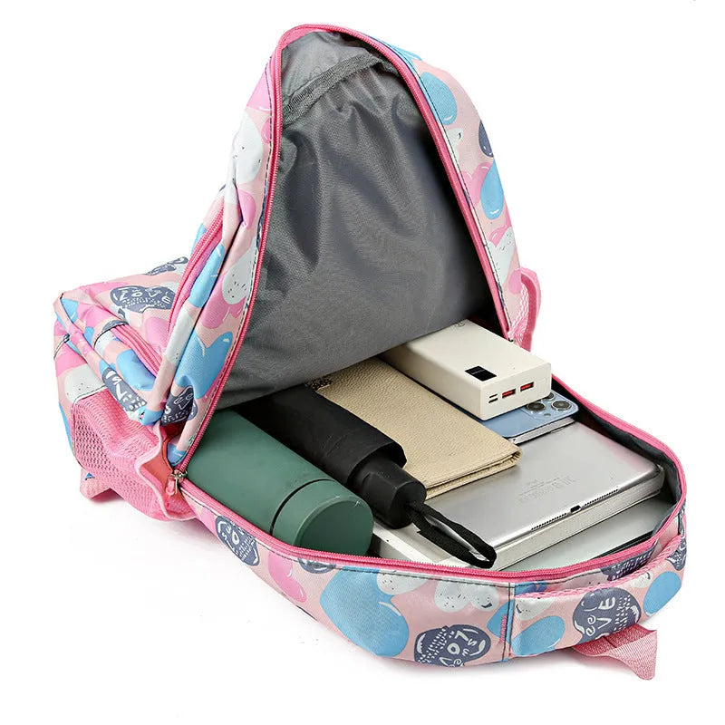 Blue children's school backpack with air pillow straps on a grey background.