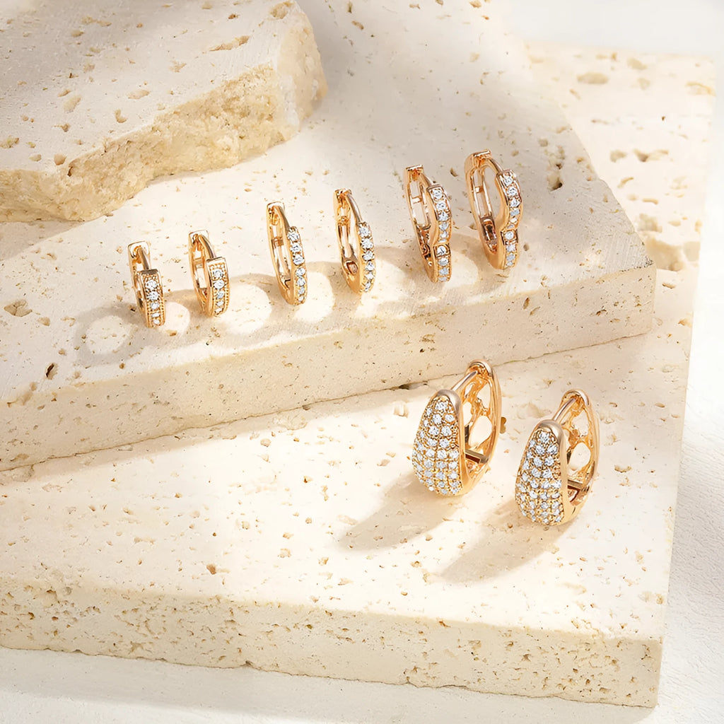 Gold plated heart-shaped ear clip earrings with zircon decoration and gang drill elements