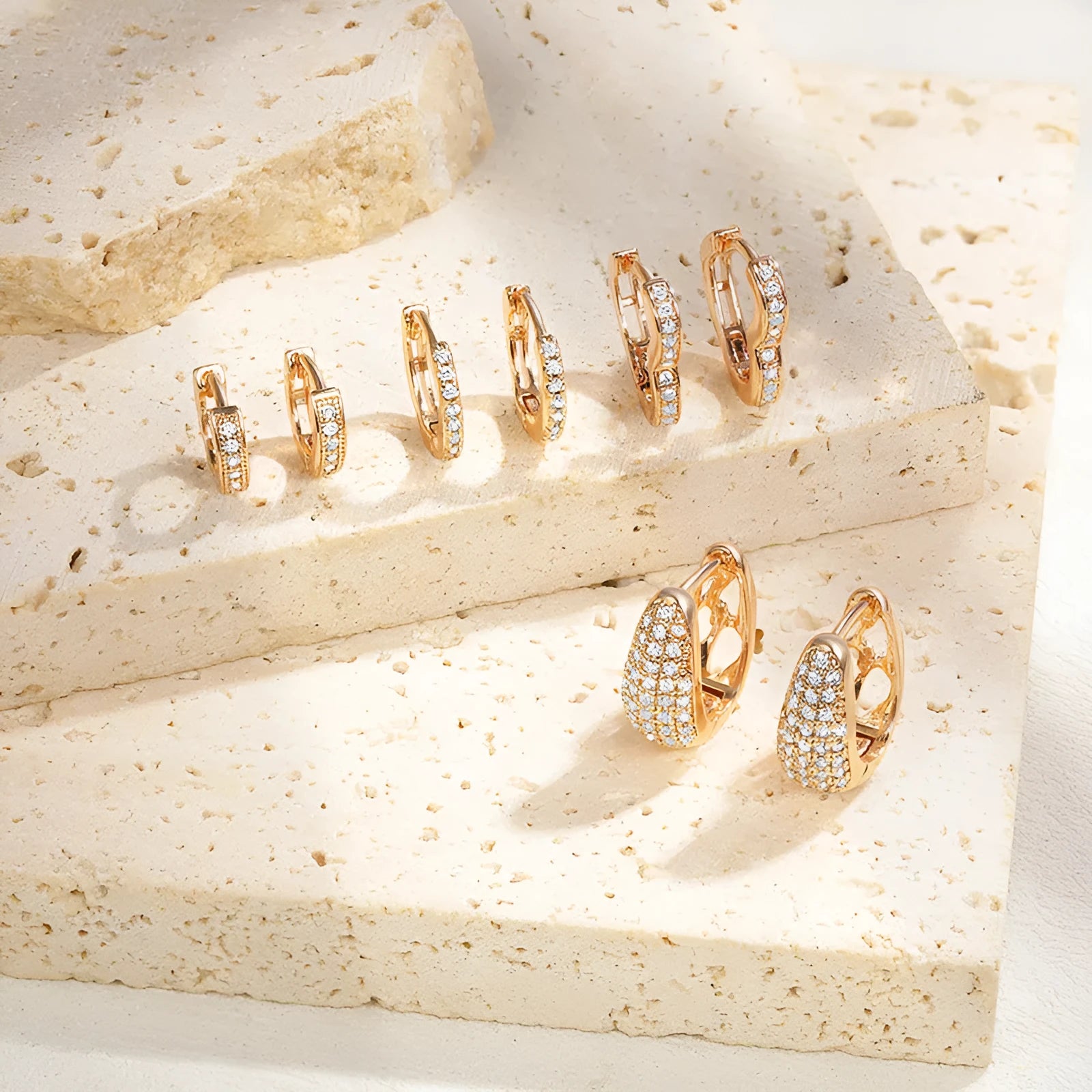 Gold plated heart-shaped ear clip earrings with zircon decoration and gang drill elements