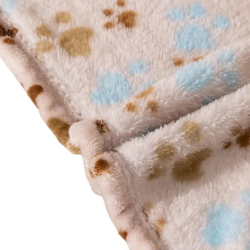 Blue dog cartoon print pet blanket laid flat, showing double-sided flannel texture.
