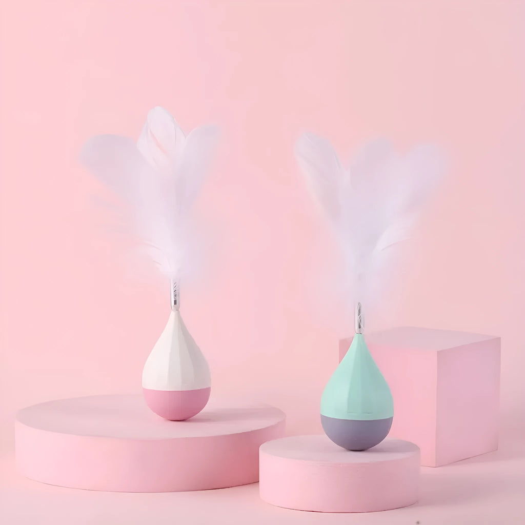 Green or pink feather tumbler cat toy with aluminium rod and self-healing ball component