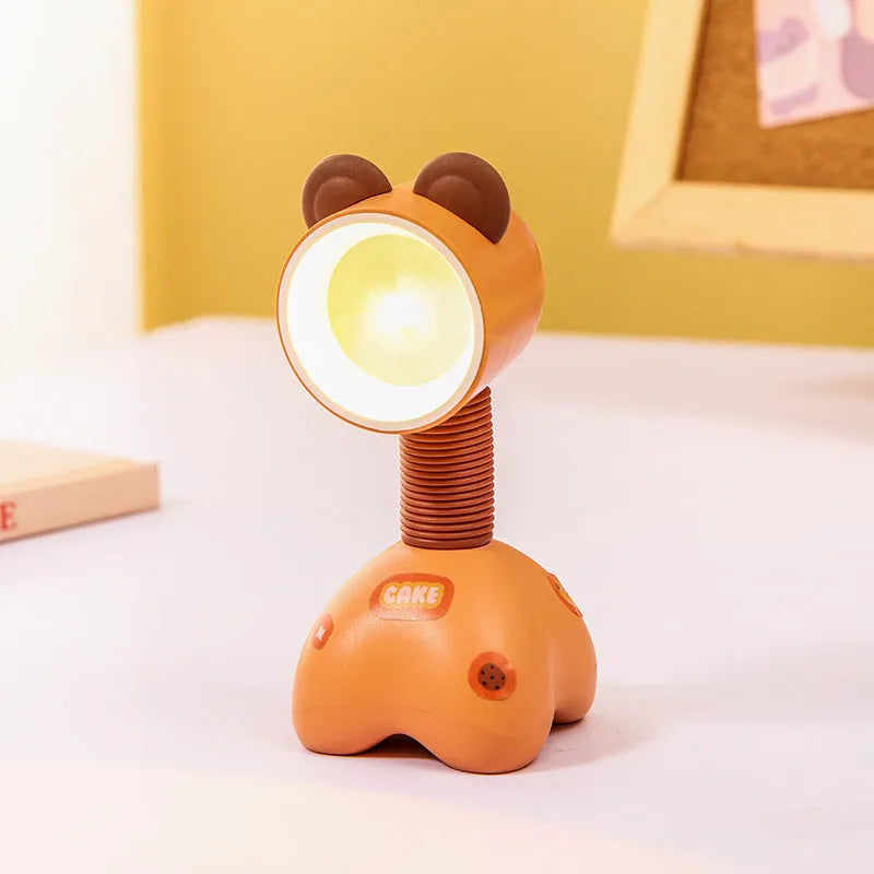 DIY magnetic cartoon small night lamp with multi-angle adjustable lighting on desktop