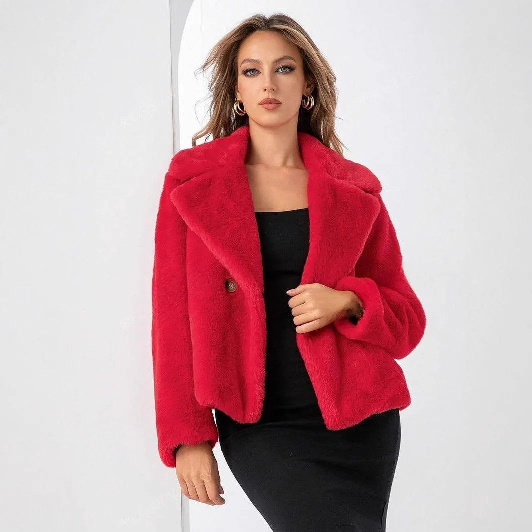 Rose red women's short faux fur coat with a loose fit and regular sleeves on a hanger.